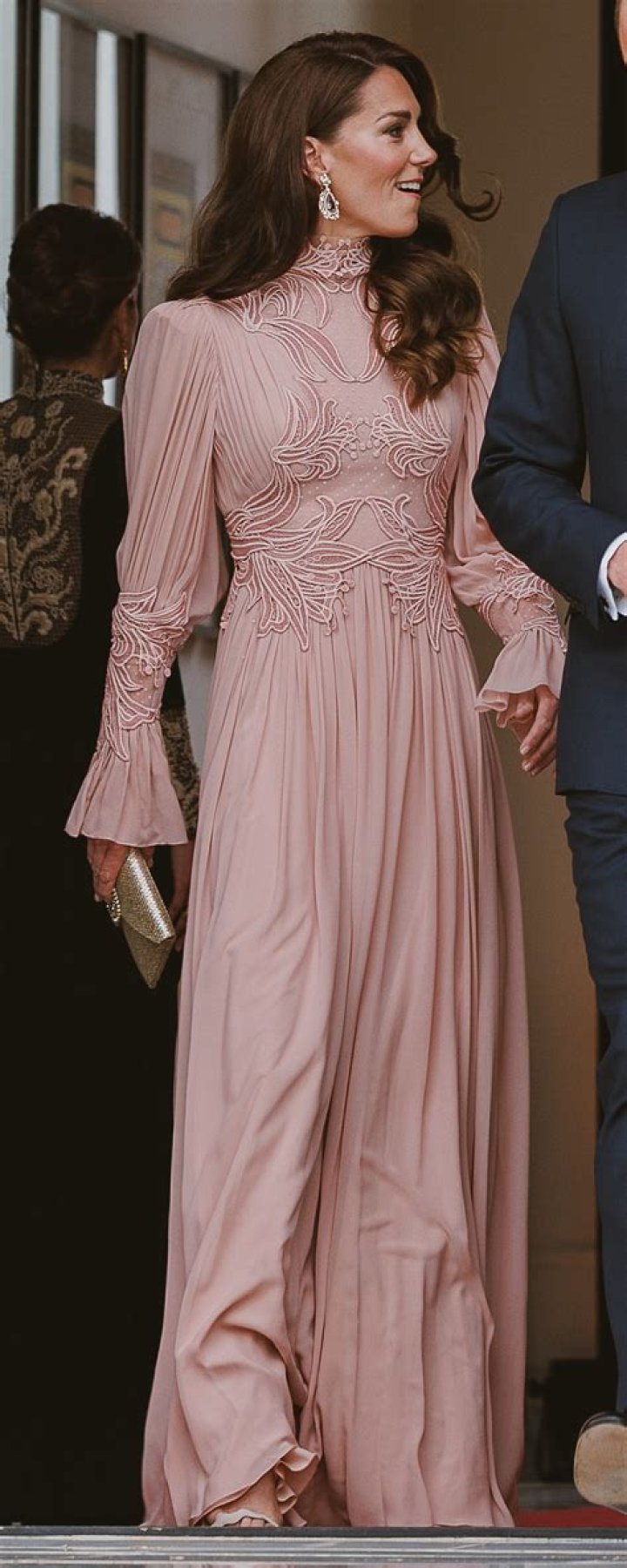 Kate Middleton, in a pale pink suit