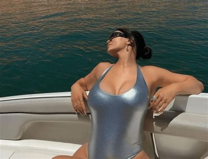 Kylie Jenner sunbathing on a boat in a space swimsuit