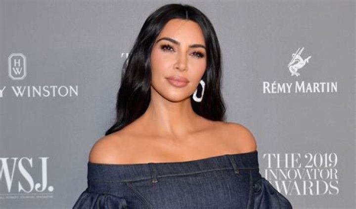 Kim Kardashian in Bathing Suit Throws Peace Sign — Celebwell