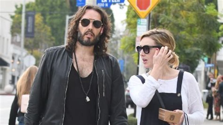 Who is Russell Brand’s wife, Laura Gallacher, and how many kids do they have?
